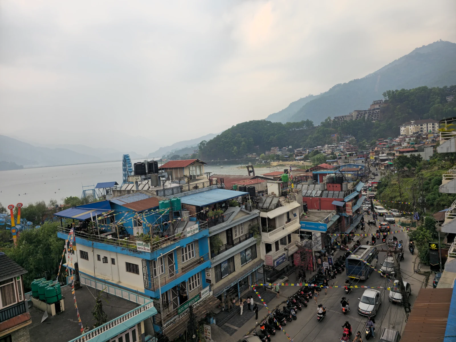 Buildings and an active street beside the Lakeside shore in Pokhara.